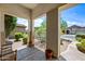 Covered front porch offers a welcoming entrance to the home with nice views at 7342 E Norwood St, Mesa, AZ 85207