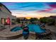 Beautiful backyard pool with a spa, mature landscaping, and a covered patio, perfect for relaxing and entertaining at 7342 E Norwood St, Mesa, AZ 85207