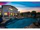 Picturesque backyard pool and spa with lush landscaping, covered patio, and outdoor seating, creating a serene oasis at 7342 E Norwood St, Mesa, AZ 85207