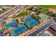 Aerial view of community tennis and basketball courts, surrounded by desert landscape and green spaces at 7342 E Norwood St, Mesa, AZ 85207