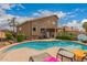 Backyard featuring a sparkling pool, lush greenery, and ample space for outdoor activities and enjoyment at 7460 E Kiowa Ave, Mesa, AZ 85209