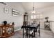 Dining room featuring a dining table, display cabinet and neutral color palette at 7460 E Kiowa Ave, Mesa, AZ 85209