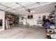 Spacious garage with ample storage and room for multiple vehicles and featuring an overhead storage system at 7460 E Kiowa Ave, Mesa, AZ 85209