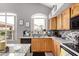 Well-lit kitchen featuring an island and tile backsplash at 7460 E Kiowa Ave, Mesa, AZ 85209
