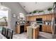 Charming kitchen featuring wooden cabinets, granite countertops, and stainless steel appliances at 7460 E Kiowa Ave, Mesa, AZ 85209