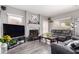 Comfortable living room with fireplace, modern flooring, and plush seating at 7460 E Kiowa Ave, Mesa, AZ 85209