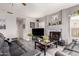 Comfortable living room with fireplace, modern flooring, and plush seating at 7460 E Kiowa Ave, Mesa, AZ 85209