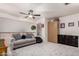 The loft is furnished with a comfortable sofa, a wardrobe, and soft carpeting, creating a cozy retreat within the home at 7460 E Kiowa Ave, Mesa, AZ 85209