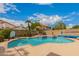 Sparkling pool surrounded by mature landscaping and lounge chairs, creating a backyard oasis at 7460 E Kiowa Ave, Mesa, AZ 85209