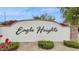 Elegant community entrance sign with lush landscaping, showcasing the beautiful Eagle Heights neighborhood at 7587 W Quail Ave, Glendale, AZ 85308