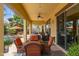 Inviting covered patio with outdoor seating, perfect for entertaining or relaxing by the landscaped backyard at 7587 W Quail Ave, Glendale, AZ 85308