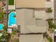 Aerial view of property showing a swimming pool and modern landscaping at 8214 S 48Th Dr, Laveen, AZ 85339