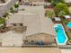 This aerial view captures a house with a private pool and covered patio for outdoor enjoyment at 8214 S 48Th Dr, Laveen, AZ 85339