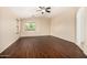 Open bedroom with ceiling fan, carpet and bright window at 8214 S 48Th Dr, Laveen, AZ 85339