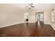 Spacious bedroom with dark wood floors, neutral walls and bright window at 8214 S 48Th Dr, Laveen, AZ 85339
