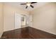 Large room with sliding doors and a ceiling fan at 8214 S 48Th Dr, Laveen, AZ 85339