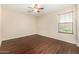 Comfortable bedroom with a ceiling fan and a window with views to the outdoors at 8214 S 48Th Dr, Laveen, AZ 85339