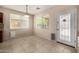 Cozy dining area is illuminated by modern light fixture with plenty of natural lighting at 8214 S 48Th Dr, Laveen, AZ 85339