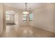 Spacious dining room with tile floors and neutral walls offers plenty of space for entertaining at 8214 S 48Th Dr, Laveen, AZ 85339