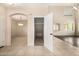 Inviting entryway with arched doorway, closet, and neutral tile flooring leads into the home at 8214 S 48Th Dr, Laveen, AZ 85339
