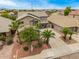 Two-story home featuring well-maintained landscaping, a spacious driveway, and a neutral color scheme at 8214 S 48Th Dr, Laveen, AZ 85339
