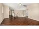 Upstairs hallway with hardwood floors and railing looking down to first floor at 8214 S 48Th Dr, Laveen, AZ 85339