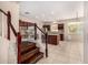 Stairway view of a gourmet kitchen featuring sleek countertops and modern stainless steel appliances at 8214 S 48Th Dr, Laveen, AZ 85339