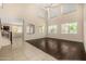 Spacious living room with high ceilings, clerestory windows, and stylish hardwood flooring feature modern design at 8214 S 48Th Dr, Laveen, AZ 85339