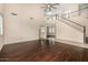 Expansive living room with hardwood floors, stairs, and large windows with plenty of natural light at 8214 S 48Th Dr, Laveen, AZ 85339