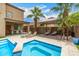 A backyard pool features a built-in spa and a covered outdoor seating area at 8214 S 48Th Dr, Laveen, AZ 85339