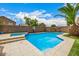 Beautiful backyard pool with spa and travertine pavers at 8214 S 48Th Dr, Laveen, AZ 85339