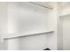 A bright, walk-in closet with rods, shelves, and ample storage space at 8214 S 48Th Dr, Laveen, AZ 85339