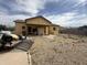 The backyard has a patio area, a detached garage, and plenty of room for outdoor activities at 9054 E Crescent Ave, Mesa, AZ 85208