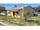 Charming single-story home with a covered porch and a well-maintained yard at 9054 E Crescent Ave, Mesa, AZ 85208