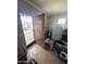 View of a cluttered foyer and the security door leading to the front yard at 9054 E Crescent Ave, Mesa, AZ 85208