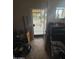 View of a cluttered foyer and the security door leading to the front yard at 9054 E Crescent Ave, Mesa, AZ 85208