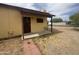 Inviting front entrance with a covered porch and a well-lit entryway at 9054 E Crescent Ave, Mesa, AZ 85208