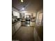 Functional kitchen with stainless steel appliances, ample cabinetry, and countertop space at 9054 E Crescent Ave, Mesa, AZ 85208
