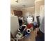 This laundry room has side-by-side washer and dryer units at 9054 E Crescent Ave, Mesa, AZ 85208