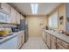 Functional kitchen featuring ample cabinetry, stainless steel refrigerator, and neutral countertops at 11260 N 92Nd St # 2111, Scottsdale, AZ 85260