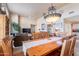 Open-concept living and dining area with ample seating, a decorative chandelier, and lots of natural light at 11260 N 92Nd St # 2111, Scottsdale, AZ 85260