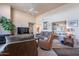 Comfortable living room featuring a fireplace, neutral tones, and a cozy seating arrangement at 11260 N 92Nd St # 2111, Scottsdale, AZ 85260
