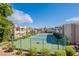 Scenic view of community tennis courts surrounded by well-maintained landscaping and multiple buildings at 11260 N 92Nd St # 2111, Scottsdale, AZ 85260