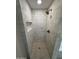 Walk-in shower featuring white tile and modern shower head at 1149 S 98Th St, Mesa, AZ 85208