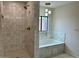 Newly renovated bathroom with walk in shower and soaking tub at 1149 S 98Th St, Mesa, AZ 85208