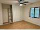 Bedroom with new flooring, ceiling fan, closet and view to the backyard at 1149 S 98Th St, Mesa, AZ 85208
