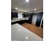 Modern kitchen featuring black cabinetry, stainless steel appliances, and quartz countertops at 1149 S 98Th St, Mesa, AZ 85208