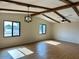 Spacious living room with exposed beams, modern light fixtures and beautiful windows at 1149 S 98Th St, Mesa, AZ 85208