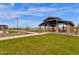 View of community park featuring covered picnic pavilion, walking trails, and green space for activities at 1171 E Peach Tree Dr, Chandler, AZ 85249