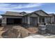 New construction home showing front elevation with two car garage and covered front porch at 1171 E Peach Tree Dr, Chandler, AZ 85249